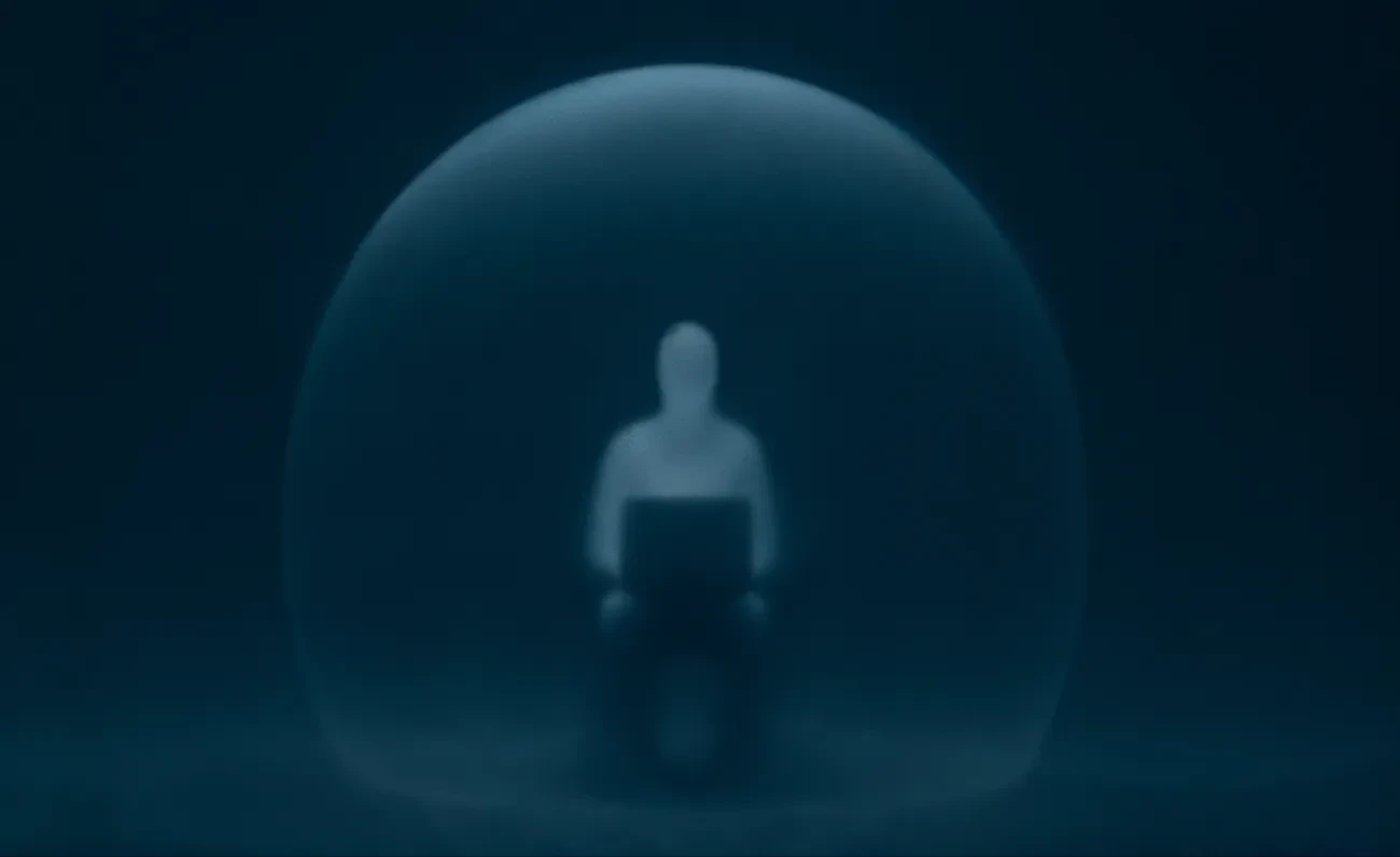 Person with laptop in transparent sphere