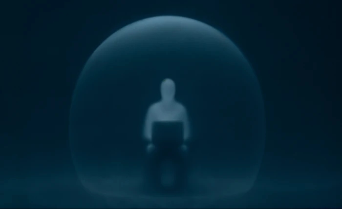 Person with laptop in transparent sphere